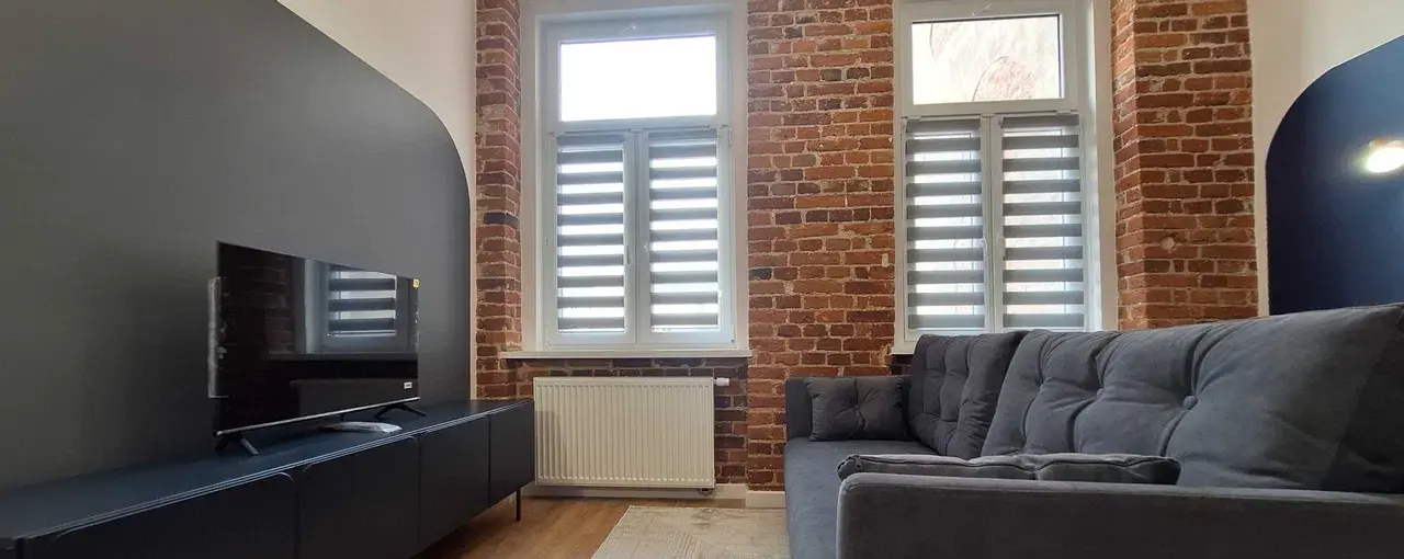Industrialny apartament w stylu loftowym przy Manufakturze, ul. Mielczarskiego 14.